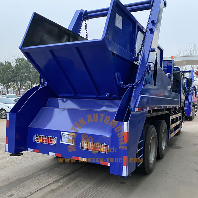 garbage truck picking up bin